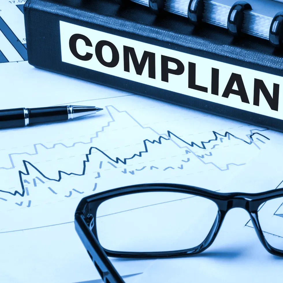 compliance-documents-pen-glasses